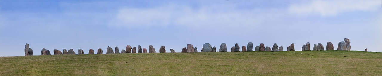 Line of standing stones at the top of a grassy flat area at the horizon.
image is on the SARA By-Laws page
